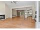 Open-concept living space with hardwood floors connecting to a modern kitchen, perfect for seamless entertaining at 6249 Hayden Dr, Hickory, NC 28601