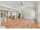 Expansive living area with hardwood floors, opening to a modern kitchen, perfect for entertaining guests and Gathering at 6249 Hayden Dr, Hickory, NC 28601