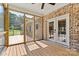 Covered back porch with wood flooring, screens, and access to the exterior at 6249 Hayden Dr, Hickory, NC 28601