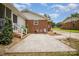 Spacious backyard with a patio, brick accent, and landscaping at 6300 Morehead Rd, Harrisburg, NC 28075