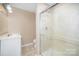Updated bathroom with a sleek glass-enclosed shower and modern vanity at 6300 Morehead Rd, Harrisburg, NC 28075