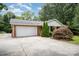 A single-Gathering brick home with an attached garage and a well-manicured yard at 6300 Morehead Rd, Harrisburg, NC 28075