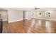 Open living area with hardwood floors and access to the backyard at 6300 Morehead Rd, Harrisburg, NC 28075