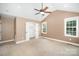 Open and airy main bedroom features carpet, ceiling fan, and closet at 6300 Morehead Rd, Harrisburg, NC 28075