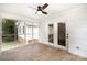 Relaxing screened-in porch with wooden flooring and view of the backyard at 6300 Morehead Rd, Harrisburg, NC 28075