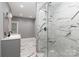 Modern bathroom featuring a glass enclosed shower and a marble patterned tile floor at 6310 Forney Hill Rd, Denver, NC 28037
