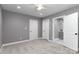 Bedroom with neutral carpet, gray walls, white trim, ceiling fan and ensuite bath at 6310 Forney Hill Rd, Denver, NC 28037