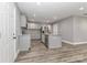 Modern kitchen showcasing light cabinets, stainless steel appliances, granite counters and wood look floors at 6310 Forney Hill Rd, Denver, NC 28037