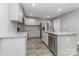 Bright kitchen featuring gray cabinets, stainless steel appliances and granite countertops at 6310 Forney Hill Rd, Denver, NC 28037