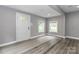 Inviting living room with wood look floors and sunlit windows for ample natural light at 6310 Forney Hill Rd, Denver, NC 28037