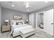 Comfortable primary bedroom with neutral decor, a ceiling fan, and an ensuite bathroom at 6310 Forney Hill Rd, Denver, NC 28037