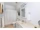 Bright bathroom features neutral sink and hardware, toilet, and shower with white curtain at 6507 Fairway Point Dr, Charlotte, NC 28269