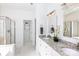 Bright bathroom features dual sinks with granite countertop and a glass-enclosed shower for a luxurious experience at 6507 Fairway Point Dr, Charlotte, NC 28269