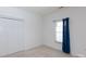 Bright bedroom with closet and window is a clean, adaptable space at 6507 Fairway Point Dr, Charlotte, NC 28269