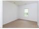 Neutral bedroom with carpet and window provides a clean, adaptable space at 6507 Fairway Point Dr, Charlotte, NC 28269
