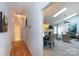 Hallway view into dining and living spaces with hardwood and ceramic tile floors at 6507 Fairway Point Dr, Charlotte, NC 28269