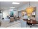 Spacious living room with vaulted ceilings, fireplace, and seamless flow to the kitchen and dining area at 6507 Fairway Point Dr, Charlotte, NC 28269
