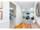 Open-concept space with a view from hardwood floors to a living room featuring a fireplace and bright kitchen at 6507 Fairway Point Dr, Charlotte, NC 28269