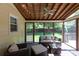Inviting screened porch offering comfortable seating with a view of the lush backyard at 6507 Fairway Point Dr, Charlotte, NC 28269