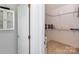 Bright walk-in closet featuring wire shelving, carpeted floor, and a glimpse of a white cabinet on the adjacent wall at 6507 Fairway Point Dr, Charlotte, NC 28269