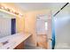 Bathroom features a single sink vanity, light bar, and shower at 6922 Brandon Chase Ln, Concord, NC 28025