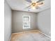 Bedroom with a ceiling fan and a window at 6922 Brandon Chase Ln, Concord, NC 28025