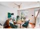 Cozy dining room with seating for six, a bright window, and a stylish mid-century modern decor at 6922 Brandon Chase Ln, Concord, NC 28025
