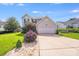 Charming two-story home features manicured lawn, neutral siding, and a convenient two-car garage at 6922 Brandon Chase Ln, Concord, NC 28025