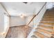 Inviting living room features a tiled floor, neutral paint, and access to a staircase at 6922 Brandon Chase Ln, Concord, NC 28025