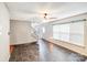 Spacious living room features a tiled floor, neutral paint, and a bright window at 6922 Brandon Chase Ln, Concord, NC 28025