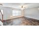 Spacious living room features a tiled floor, neutral paint, and a bright window at 6922 Brandon Chase Ln, Concord, NC 28025