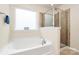 Beautiful bathroom with a soaking tub and a separate glass shower stall at 6961 Liverpool Ct, Fort Mill, SC 29707