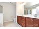 Bathroom featuring a dual sink vanity, wood cabinets, and tile flooring at 6961 Liverpool Ct, Fort Mill, SC 29707
