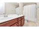 Bathroom with double sink vanity with framed mirror, and tiled flooring at 6961 Liverpool Ct, Fort Mill, SC 29707
