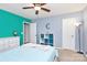 Bright bedroom featuring a globe, dresser, and modern ceiling fan at 6961 Liverpool Ct, Fort Mill, SC 29707