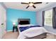 Cozy bedroom with a bright blue accent wall and a queen-sized bed at 6961 Liverpool Ct, Fort Mill, SC 29707