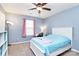 A bedroom featuring a desk, ceiling fan, and a plush area rug at 6961 Liverpool Ct, Fort Mill, SC 29707