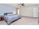 Spacious bedroom with neutral carpet and soothing wall colors and natural light at 6961 Liverpool Ct, Fort Mill, SC 29707