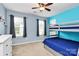This bedroom features a bunk bed, two windows, and gray trim at 6961 Liverpool Ct, Fort Mill, SC 29707