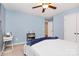 Cozy bedroom with a ceiling fan, carpet flooring, and light blue painted walls at 6961 Liverpool Ct, Fort Mill, SC 29707