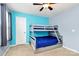 This bedroom features a gray bunk bed, ceiling fan, and light blue walls at 6961 Liverpool Ct, Fort Mill, SC 29707