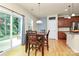 Bright dining area with sliding doors leading to the outdoors and hardwood floors at 6961 Liverpool Ct, Fort Mill, SC 29707