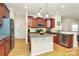 Beautiful kitchen with island, stainless appliances, and hardwood floors at 6961 Liverpool Ct, Fort Mill, SC 29707