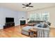 Comfortable living room with hardwood floors, gray sectional, and fireplace at 6961 Liverpool Ct, Fort Mill, SC 29707