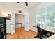 Bright home office with French doors, hardwood floors, and a large window at 6961 Liverpool Ct, Fort Mill, SC 29707