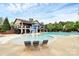 Enjoy the community pool with mushroom fountains and lounge chairs in this desirable neighborhood at 6961 Liverpool Ct, Fort Mill, SC 29707