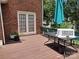 Backyard featuring a deck with seating and a well-manicured lawn at 7318 Brighton Brook Dr, Charlotte, NC 28212