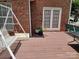 A backyard featuring a swing and a brick house at 7318 Brighton Brook Dr, Charlotte, NC 28212