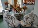 Bright dining area featuring a glass-top table, ornate chairs, and ample natural light at 7318 Brighton Brook Dr, Charlotte, NC 28212