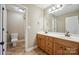 Bathroom featuring double sink vanity, tile floor, and toilet at 8137 Caliterra Dr, Charlotte, NC 28227